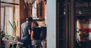 man and woman in their home