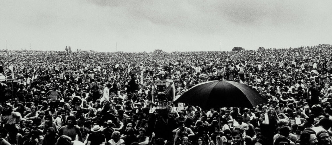 A crowd of people at the iconic woodstock concert.