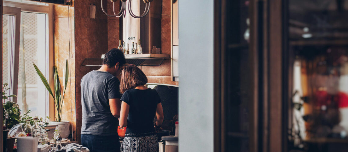 man and woman in their home