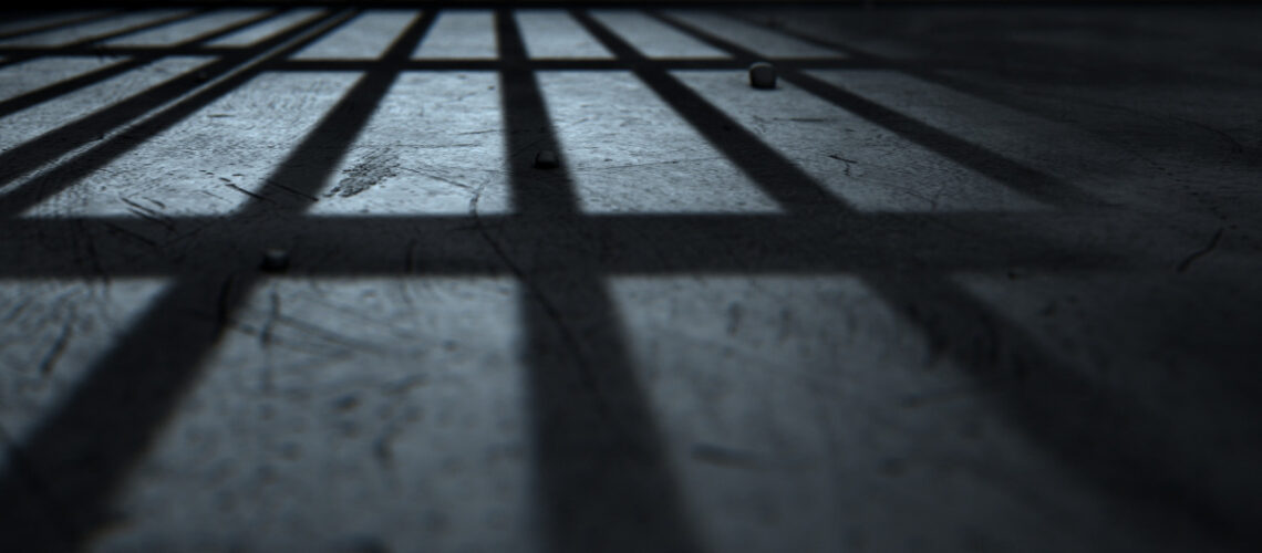 Shadow left by jail cell bars.